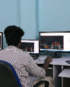 Learners practicing together at academy computer stations